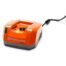 Husqvarna QC330 quick charger for lithium-ion batteries, featuring compact design and LED charging indicators.