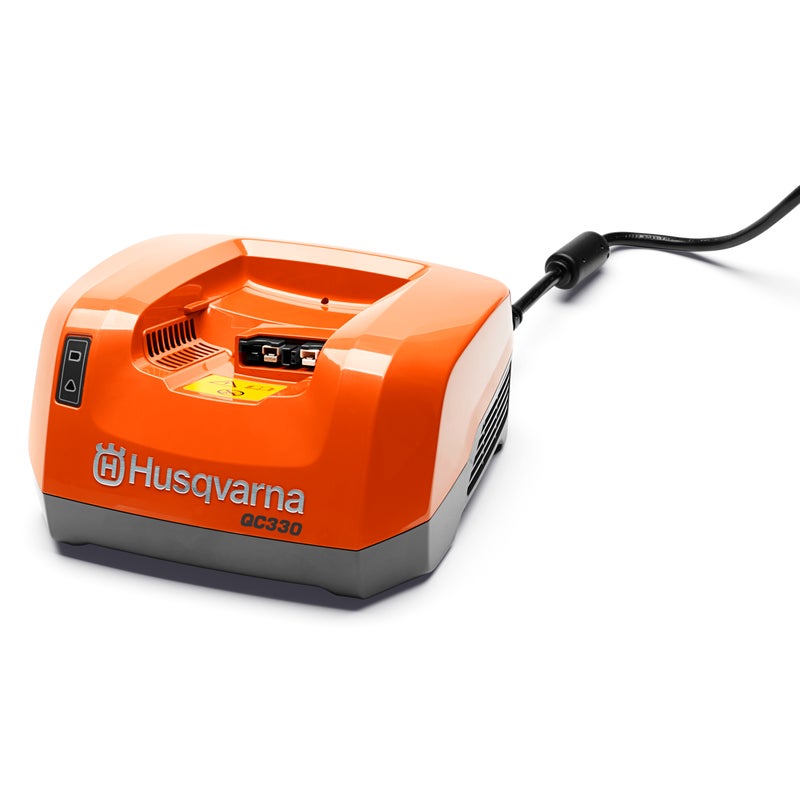 Husqvarna QC330 quick charger for lithium-ion batteries, featuring compact design and LED charging indicators.