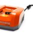 Husqvarna QC330 Quick Charger – 330 W fast charger for 36 V Li‑ion batteries, compact and efficient for cordless garden tools.