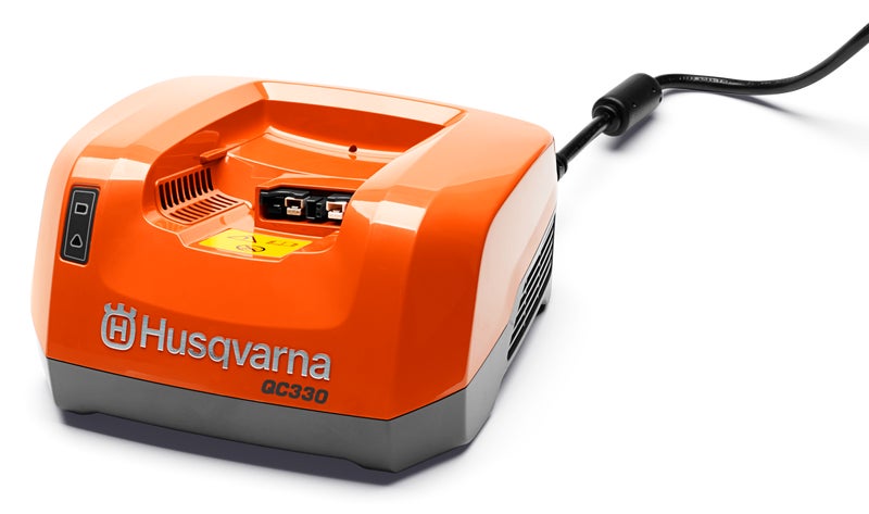 Husqvarna QC330 Quick Charger – 330 W fast charger for 36 V Li‑ion batteries, compact and efficient for cordless garden tools.