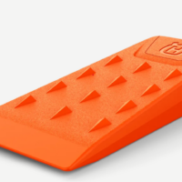 Husqvarna Plastic Felling Wedge 14cm in bright orange, made of durable impact-resistant plastic for safe tree felling.