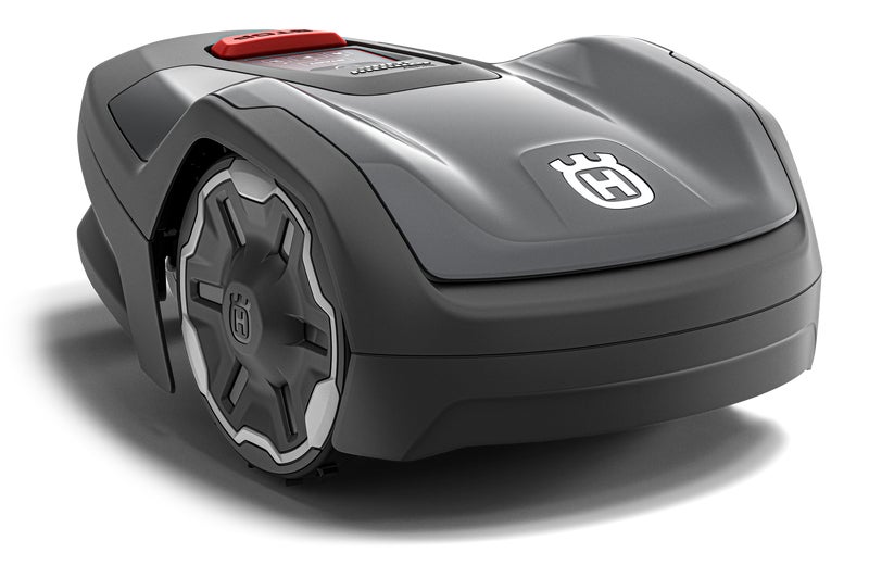 Husqvarna Automower Aspire R4 robotic lawn mower navigating a large, sloped garden with trees and shrubs.