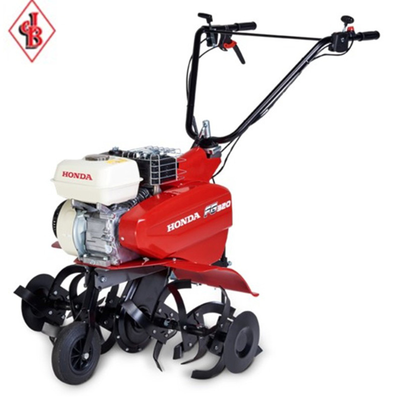 Honda FG320 compact tiller with red engine cover and black handles, designed for efficient soil cultivation.